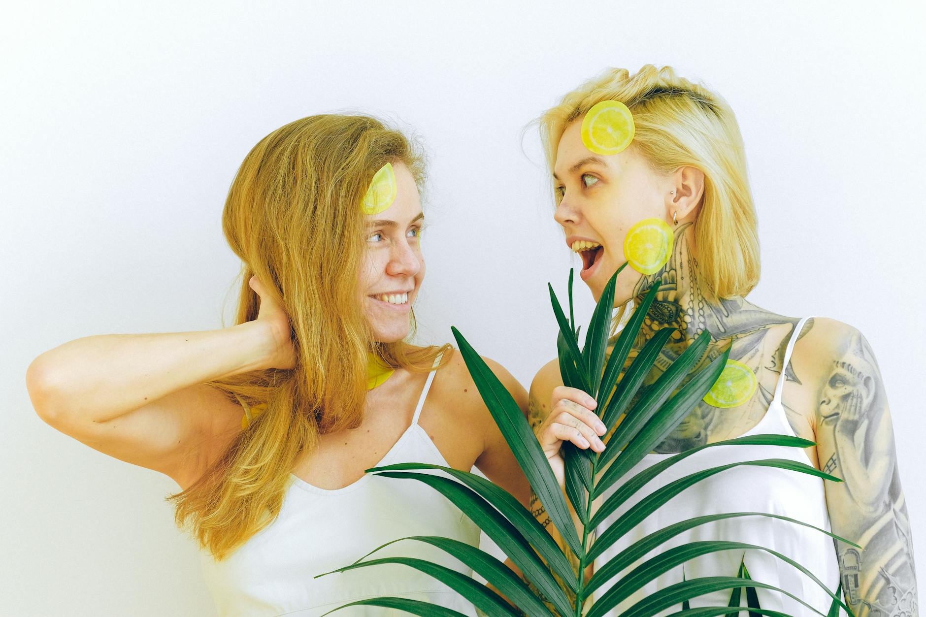 Two women smiling with joy and comfort, expressing self-care and wellbeing